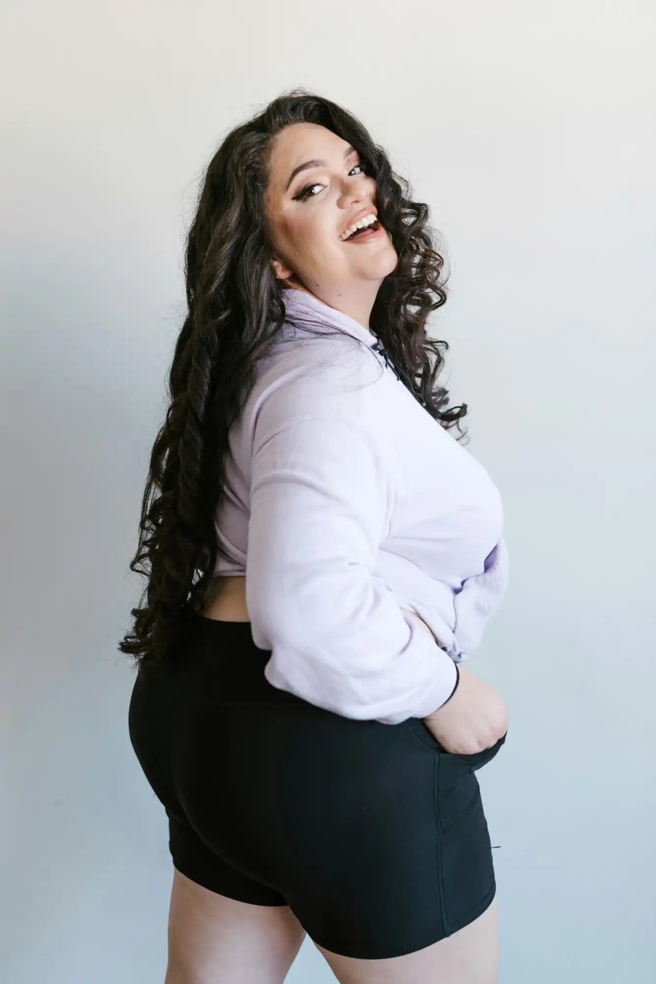 Smiling woman in casual attire.